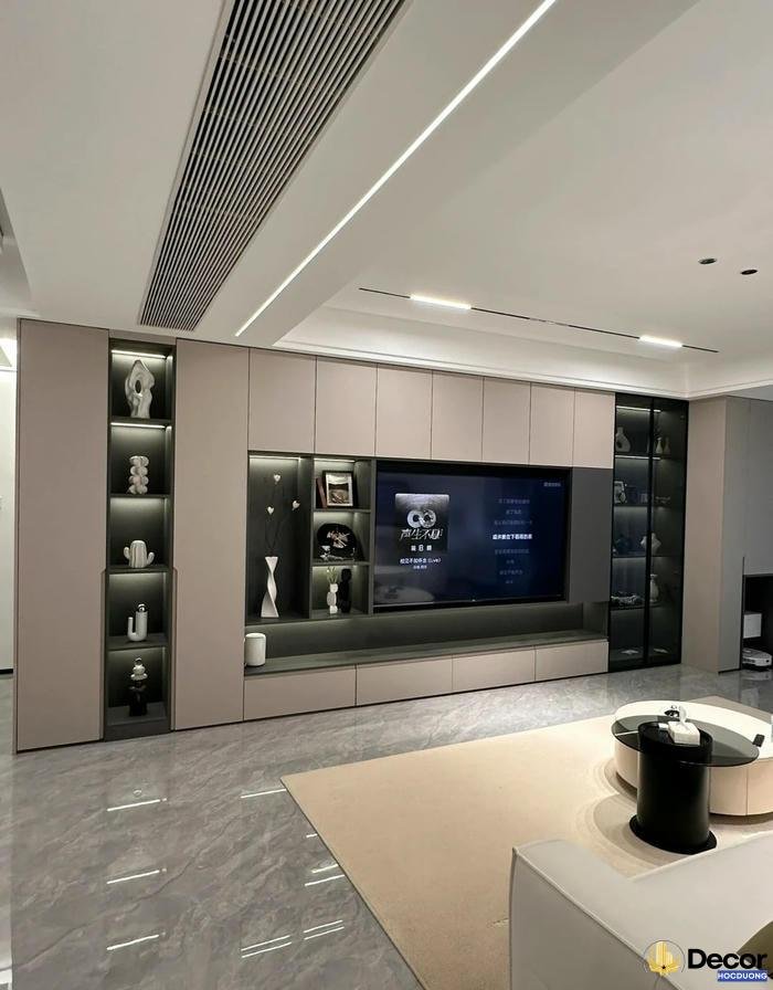 Tu trang tri phong khach giup khu vuc sinh hoat rang ro hon.